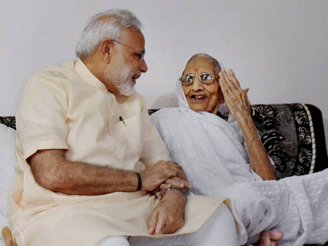 Prime Minister Narendra Modi speaks to his mother on his 67th birthday in Gandhinagar on September 17, 2016. The Prime Minister is in the state to visit his mother on his birthday.