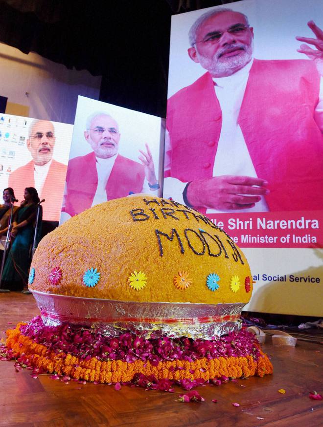 Railway Minister Suresh Parbhu (not pictured) unveiled a large laddu bearing birthday wishes for Prime Minister Narendra Modi at the inauguration of Swacchata Diwas function at Mavlankar Hall in New Delhi on September 17, 2016.