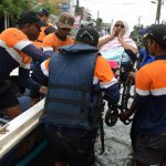 Sri Lankan navy personnel evacuate a wheelchair bound resident following flooding in the Kolonnawa suburb of Colombo on May 21.