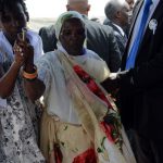 The mother of top Tutsi general Athanase Kararuza bless the coffin of her son during his funerals on April 30, 2016 in Bujumbura after he was killed with his wife in a gun and grenade attack as they were dropping their daughter off at school in the capital Bujumbura.