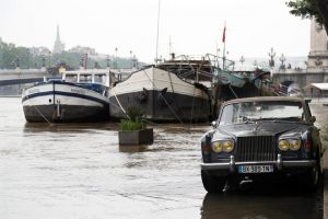 A Rolls-Royce is parked as high waters causes flooding along the Seine River in Paris, France June 1.