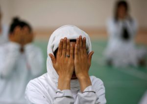 A student performs yoga during World Yoga Day in Srinagar