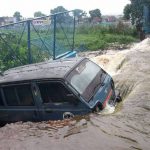 A van washed away after boundary wall of Bagh Munshi Hussain lake collapse after heavy rains in Bhopal on July 10, 2016