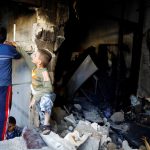 Children play inside a devastated house struck by rocket fire from Syria in Turkey's southeastern border town of Kilis on May 10.