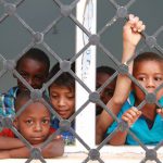 Displaced Libyan children who fled the eastern Libyan cities of Abu Grein and Sirte look out of window at a school where they are taking shelter in Bani Walid, nearly 200 kilometres south of Tripoli, on May 10.
