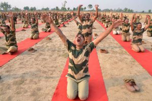 Indian Border Security Force (BSF) personnel take part in a yoga session on International Yoga Day at BSF headquarters in Khasa on the outskirts of Amritsar on June 21.