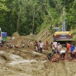 Indian labourers work to clear a landslide on the National Highway 44 at Khasiapunji some 75 kms north of Karimganj on the border of the north-eastern states of Assam and Tripura on July 11, 2016