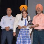 Manpreet Singh IAS Chairman of PPCB honours a students during World Environment Day celebrations at Pushpa Gujral Science City in Kapurthala