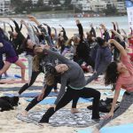 Participants strike a pose during an event to mark International Yoga Day, at Bondi Beach in Sydney, Australia.