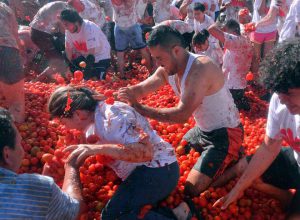 People participate in the tenth annual tomato fight festival, known as ‘tomatina’, in Sutamarchan, Boyaca department, Colombia, on June 5, 2016.