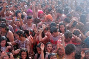 People participate in the tenth annual tomato fight festival, known as ‘tomatina’, in Sutamarchan, Boyaca department, Colombia, on June 5, 2016.