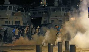 Police disperse revellers at the old port of Marseille after the England v Russia-Group B match.