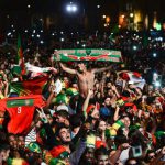 Portugal's national football team supporters celebrate their team's victory at Terreiro do Paco square in Lisbon on July 10, 2016 after watching on a giant screen the Euro 2016 final football match Portugal vs France played in Paris.