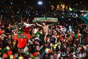 Portugal's national football team supporters celebrate their team's victory at Terreiro do Paco square in Lisbon on July 10, 2016 after watching on a giant screen the Euro 2016 final football match Portugal vs France played in Paris.