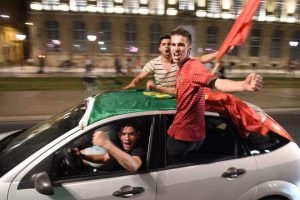 Portugal's supporters celebrate in the streets of Bordeaux on July 10, 2016, after Portugal won the Euro 2016 final football match between France and Portugal.