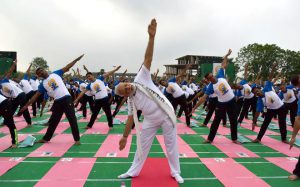Prime Minister Narendra Modi participates in a mass yoga session along with other Indian yoga practitioners to mark the 2nd International Yoga Day at Capitol complex in Chandigarh on June 21.