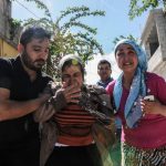 Residents flee as rockets fired from Syria land in the Turkish town of Kilis on April 19, 2016.