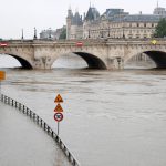 Road signs appear isolated in the rising waters from the Seine River as high waters causes flooding along the Seine River in Paris, France, June 1.