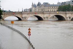 Road signs appear isolated in the rising waters from the Seine River as high waters causes flooding along the Seine River in Paris, France, June 1.