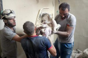 Syrian civil defence volunteers, known as the White Helmets, retrieve bodies from under the rubble of a building following a reported airstrike on September 23, 2016, on the al-Muasalat area in the northern Syrian city of Aleppo.