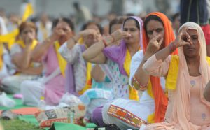 Women perform yoga on the occasion of 2nd International Yoga Day at Karna stadium in Karnal