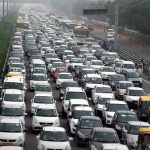Traffic stretches back in Hero Honda chowk as waterlogging during monsoon downpours causes traffic jams in Gurgaon