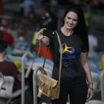 A ceremony attendee takes a selfie prior to the opening ceremony of the Rio 2016 Olympic Games at the Maracana stadium in Rio de Janeiro on August 5, 2016.