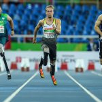 Brazil's Alan Fonteles Cardoso Oliveira (L), Germanys Johannes Floors (C) and New Zealands Liam Malone compete during a heat of mens 100 m (T44) of the Rio 2016 Paralympic Games at Olympic Stadium in Rio de Janeiro on September 8, 2016.