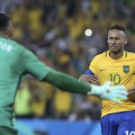 Brazil’s goalkeeper Weverton and forward Neymar react after winning the gold medals at Rio 2016 Olympic Games men’s football gold medal match between Brazil and Germany at the Maracana stadium in Rio de Janeiro on August 20, 2016