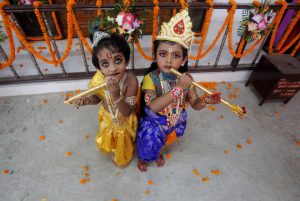 Children dressed up as Lord Krishna pose during Janmashtami festival celebrations marking the birth anniversary of Krishna in Agartala