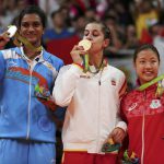 Gold medallist Carolina Marin of Spain, silver medallist PV Sindhu of India and bronze medallist Nozomi Okuhara of Japan pose together at the Riocentro stadium in Rio de Janeiro on August 19, 2016.
