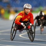 Huang Lisha of China looks up after winning the gold medal in Women’s 100m T53 Final of the Rio 2016 Paralympic Games at Olympic Stadium in Rio de Janeiro on September 8, 2016.