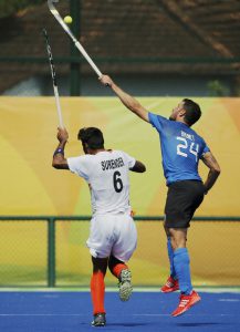 India’s Surender Kumar (L) competes with Argentina’s Manuel Brunet during the men’s field hockey Argentina vs India match of the Rio 2016 Olympics Games at the Olympic Hockey Centre in Rio de Janeiro on August 9, 2016.