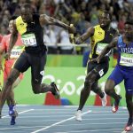 Jamaica’s Nickel Ashmeade, second right, passes the baton to Usain Bolt in the men’s 4 x 100-meter relay final at the Olympic stadium in Rio de Janeiro, Brazil, on August 19, 2016