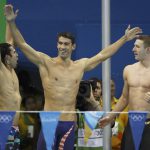 Michael Phelps, Cody Miller and Ryan Murphy of USA celebrate winning the gold Medal in the Men’s 4 x 100m Medley Relay Final at Olympic Aquatics Stadium in Rio de Janeiro, Brazil, on August 13, 2016.