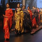 Models showcase creations by designer Santosh Parekh during the Lakme Fashion Week (LFW) Winter/Festive 2016 in Mumbai on August 28, 2016.
