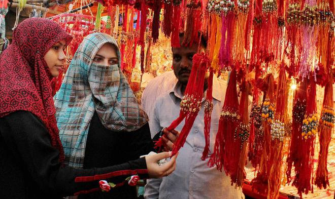 Muslim women selecting Rakhi at a market on the eve of Raksha Bandhan festival in Nagpur.