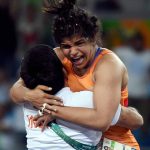 Sakshi Malik celebrates with her coach Kuldeep Singh after winning bronze against Kyrgyzstan’s Aisuluu Tynybekova in the women’s wrestling freestyle 58kg