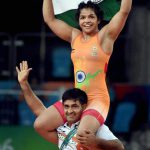 Sakshi Malik’s coach Kuldeep Singh carries her on his shoulders as they celebrate her Bronze medal against Kyrgyzstan’s Aisuluu Tynybekova in the women’s wrestling freestyle 58kg