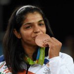 Sakshi Malik poses with her bronze medal for the women’s wrestling freestyle 58kg competition during the medals ceremony