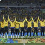Team Brazil celebrate on the podium after they won gold medals for defeating Germany in Rio 2016 Olympic Games men’s football gold medal match between Brazil and Germany at the Maracana stadium in Rio de Janeiro on August 20, 2016
