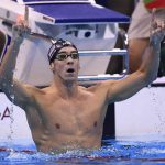 USA’s Michael Phelps celebrates after winning the Men’s 200m Butterfly Final during the swimming event at the Rio 2016 Olympic Games at the Olympic Aquatics Stadium in Rio de Janeiro on August 9, 2016.