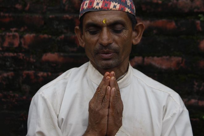 A Nepalese Hindu Brahmin priest prays during the Rishi Panchami festival in Kathmandu on September 6.