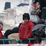 A child reacts while waiting with others to be evacuated from a rebel-held sector of eastern Aleppo, Syria, on December 16, 2016.