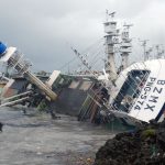 A general view shows an overturned fishing boat in the aftermath of super typhoon Meranti, at Sizihwan in Kaohsiung on September 15, 2016.
