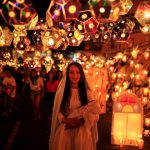 A girl dressed as the Virgin Mary pose for a photo during the Lantern Festival celebrating the eve of the nativity of the Virgin Mary in Ahuchapan, El Salvador, on September 7, 2016.