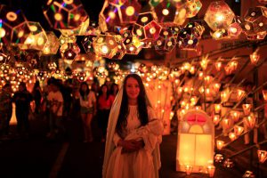 A girl dressed as the Virgin Mary pose for a photo during the Lantern Festival celebrating the eve of the nativity of the Virgin Mary in Ahuchapan, El Salvador, on September 7, 2016.