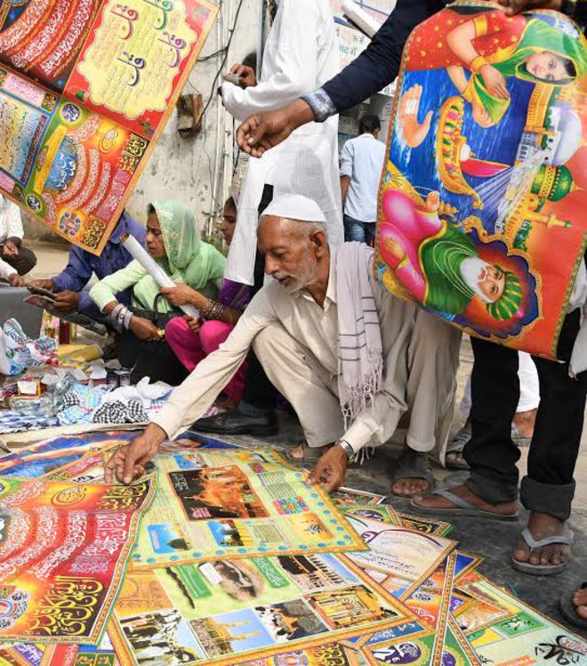 A man shops on the occasion of Eid al-Adha in Karnal