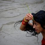 A woman performs a ritual as she take a holy bath in the Bagmati River, during the Rishi Panchami festival, in Kathmandu, Nepal on September 6. Rishi Panchami marks the end of the three-day long Teej Festival. Married Hindu women fast during the day and pray for long lives for their husbands, while unmarried women wish for handsome husbands and happy conjugal lives.