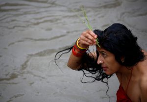 A woman performs a ritual as she take a holy bath in the Bagmati River, during the Rishi Panchami festival, in Kathmandu, Nepal on September 6. Rishi Panchami marks the end of the three-day long Teej Festival. Married Hindu women fast during the day and pray for long lives for their husbands, while unmarried women wish for handsome husbands and happy conjugal lives.